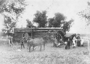 AV-81-6659  Justus family and original log home. circa 1856.